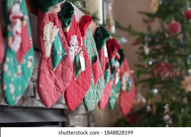 Christmas Stockings Hung By Fireplace  And Tree