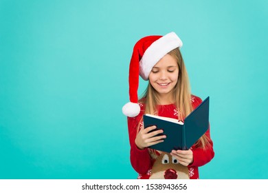 Christmas Stories. Little Reader Copy Space. Magic Xmas Spirit. Best Christmas Book. Books Store Commercial. Little Smiling Child Read Book. Christmas Eve. Little Girl Enjoy Reading Christmas Story.