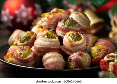 Christmas Streaky Bacon Wrapped Brussel Sprouts With Decoration, Gifts, Green Tree Branch On Wooden Rustic Table