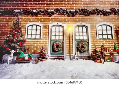 Christmas street interior studio decorations with brick wall, street light, wooden doors and christmas tree 