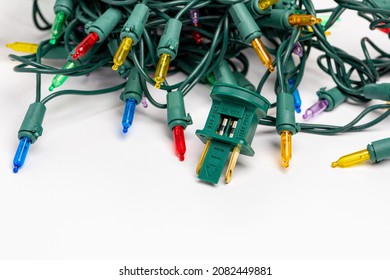 Christmas String Lights Fuse And Plug. Holiday Lighting Repair, Safety And Decoration Concept.