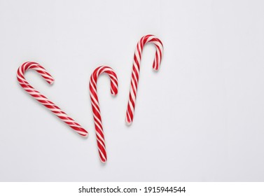 Christmas Striped Candy Canes On White Background.