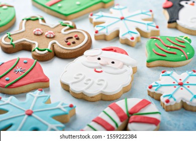 Christmas Sugar Cookies Decorated With Royal Icing With A Santa Cookie In The Middle