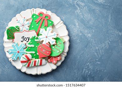 Christmas Sugar And Gingerbread Cookies Decorated With Royal Icing On A Plate Overhead