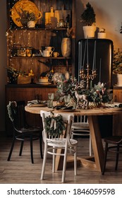 Christmas Table Decoration, Banquet Table With Glasses Before Serving Food, Close-up Of Christmas Dinner Table With Seasonal Decorations, Crystal Glasses And Decorative Deer