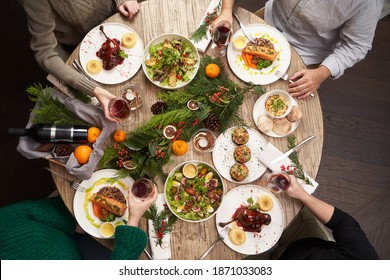 Christmas Table With Food, Top View. Friends Having Dinner. People Eat Healthy Food Together, Home Party