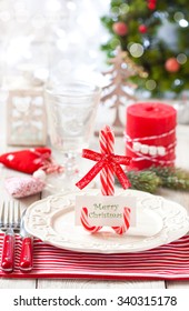 Christmas Table Place Setting. Elegant Empty Plate, Cutlery, Napkin And Blank Name Card On Candy Cane Stand.