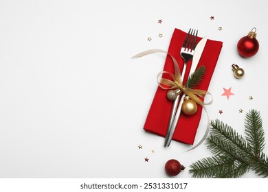 Christmas table setting. Cutlery, napkin and festive decor on white background, flat lay. Space for text - Powered by Shutterstock