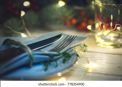 Christmas table setting on wooden background