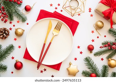 Christmas table setting with plate, cutlery and christmas decorations on white background. - Powered by Shutterstock