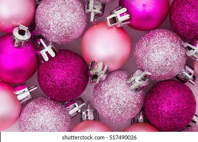 Christmas Time Background, Some pale and bright pink sparkle and matte Christmas ball ornaments background