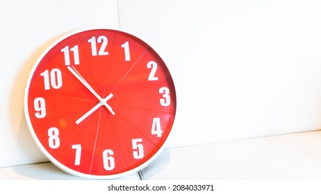 Christmas Time Concept A Large Red Clock Displays A Text Area Background. Waiting To Celebrate. Time Lapse.