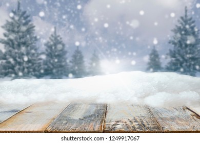 Christmas Time, Front View With Wooden Table, Sky And Snow With Tree Background, Free/copy Space