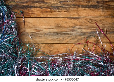 Christmas Tinsel Lies Tangled Heap On Old Wooden Table