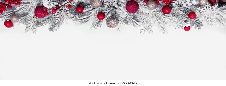 Christmas top border of red and gold baubles, snowy branches and snowflakes. Overhead view on a white banner background. Copy space. - Powered by Shutterstock