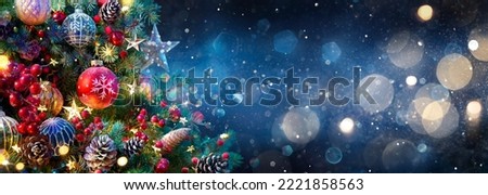 Christmas Tree With Baubles In Blue Night - Ornaments On Fir Branches With Glittering And Defocused Lights In Abstract Background