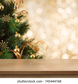 Christmas Tree Branch Behind Empty Wood Table Or Shelf