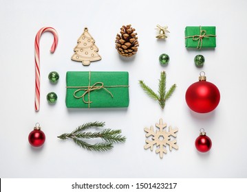 Christmas tree branches and festive decoration on white background, top view - Powered by Shutterstock