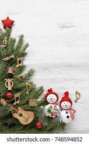 Christmas Tree Branches With Music Notes, Instruments, Snowman  On Wooden 