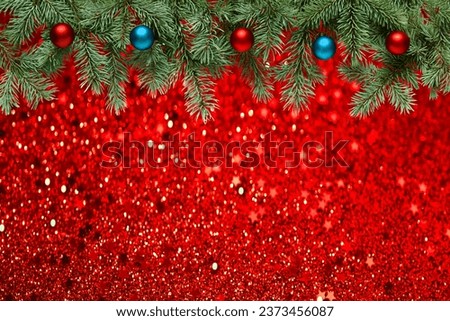 Christmas tree branches with red and blue balls, border. Red glitter confetti, luxury Christmas backdrop with stars and bokeh lights. Holiday greeting card. Blank Mockup for your congratulations