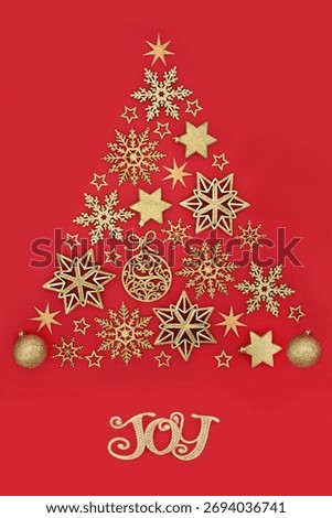 Christmas tree concept shape with joy sign, gold star snowflake, sphere decorations on red background. Icon symbol for the Xmas holiday season.  