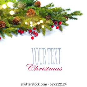 Christmas Tree with Cones border isolated on a White background. New Year holiday evergreen tree, Xmas green art corner design. Branches of fir tree decorated with holly berry, cone, light garland