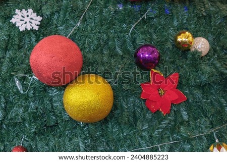 Christmas tree decorated with colorful balls and flowers 