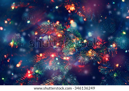 Christmas tree decorated with garlands, close-up