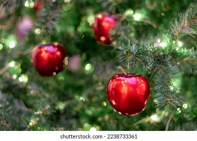 A Christmas tree decorated with red apples. Postcard. Congratulation. - Powered by Shutterstock