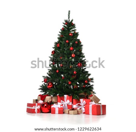 Christmas tree decorated with red patchwork ornament artificial balls craft presents for new year isolated on white background