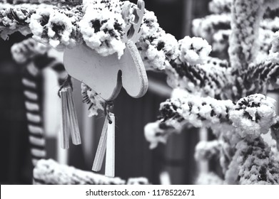 Christmas Tree Decorated With Snow And Rustic Wooden Old Times Fashioned Elk Toy. Festive Ambiance At Traditional Christmas Market. Black And White Photo.