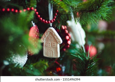 Christmas Tree Decoration In The Form Of A House Scandinavian Style Cozy On A Branch. Housing Rental Concept, Realtor Services, Mortgage, Purchase, Loan