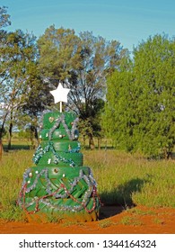 Christmas Tree Decoration. A Typical Element Of The Australian Landscape - Creative Decorations Of Car Tires Upon Entrance To A Farm In The Australian Outback Somewhere In New South Wales, Australia