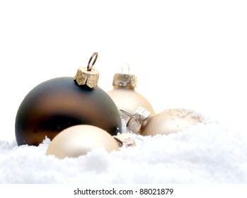christmas tree decorations lying in the snow