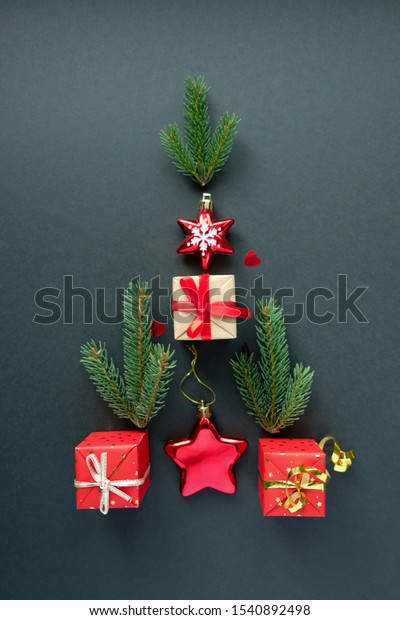 Christmas tree with Christmas elements on\
black background