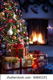 Christmas Tree And Christmas Gift Boxes In The Interior With A Fireplace