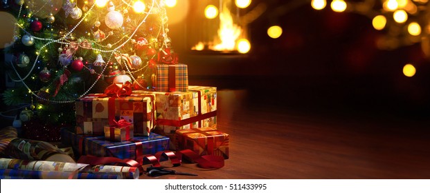 Christmas Tree And Holidays Present On Cfireplace Red Background