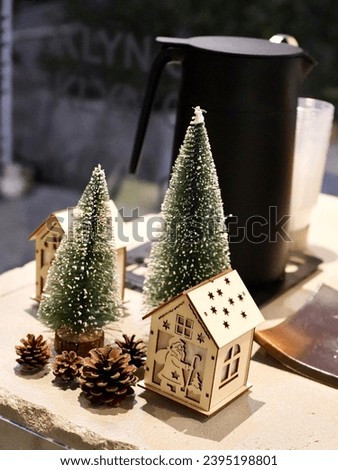 Christmas tree and house of santa claus model toy.