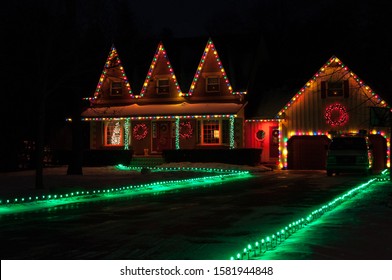 Christmas Tree Light Holiday Decoration: Illuminated Windows, House And Christmas Trees In Night. Bowmanville, Ontario, Canada