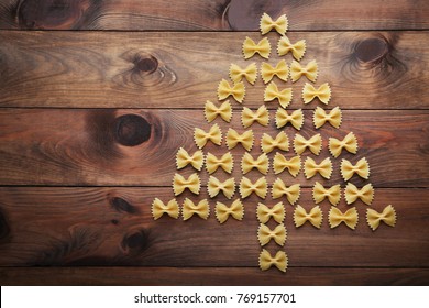 Christmas Tree Made From Bow Tie Pasta On Wooden Table