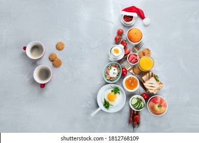 Christmas tree made of breakfast menu on light grey background. Top view