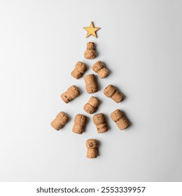 Christmas tree made of champagne corks with a golden star on top, on a white background. Creative festive arrangement symbolizing celebration and joy. - Powered by Shutterstock