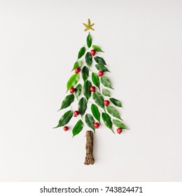 Christmas Tree Made Of Leaves And Branch. Flat Lay. New Year Nature Minimal Concept.