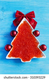 Christmas Tree Made Of Red Caviar In A Decorative Plate On The Christmas Table. Seafood. Top View. Holidays And Events.