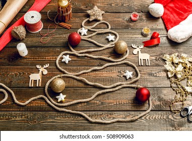 Christmas tree made of rope on a wooden background