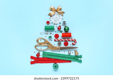 Christmas tree made of sewing accessories and decorations on color background - Powered by Shutterstock