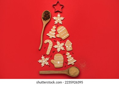 Christmas tree made of tasty cookies, cutter and spices on red background