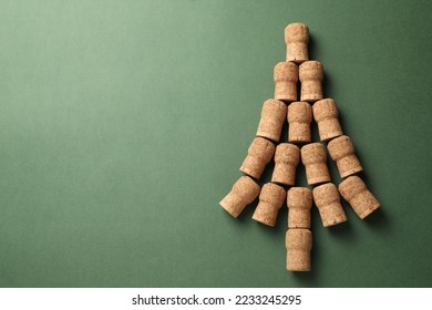 Christmas tree made of wine corks on green background, top view. Space for text - Powered by Shutterstock