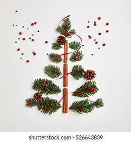 Christmas Tree Made Of Winter Foliage And Cinnamon Sticks. Holiday Concept. Flat Lay