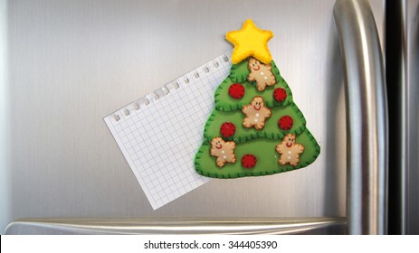 Christmas Tree Magnet Pin With Blank Note Stuck In An Aluminum Double Door Refrigerator